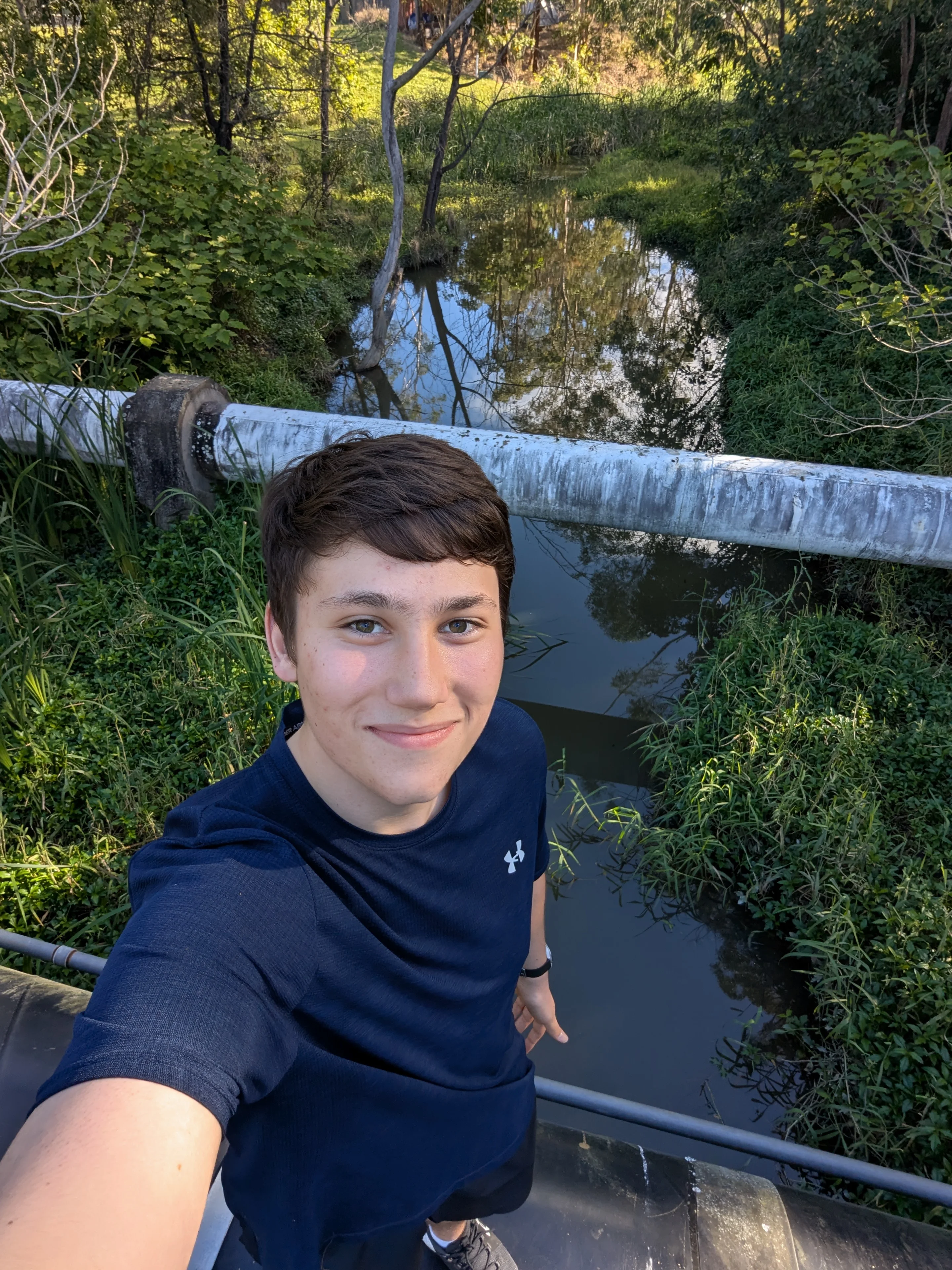 Me on a pipeline over a river making my way to a Geocache